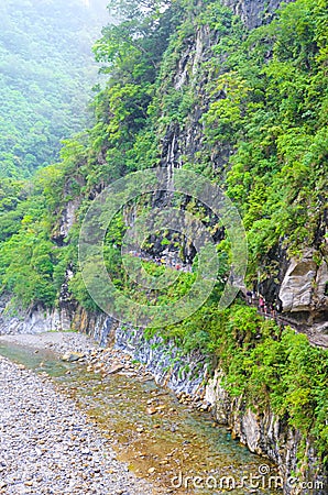 Vertical photo of Taroko National Park in Taiwan. Named after Taroko Gorge by the Liwu River. Green tropical forests surrounded by Stock Photo