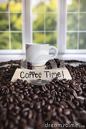 Vertical photo white ceramic espresso cup dark coffee beans coffee time! sign Stock Photo