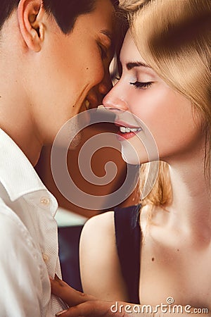 Vertical photo of young lovers kissing Stock Photo