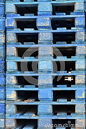 Stacks of wooden cargo shipping pallets. Stock Photo