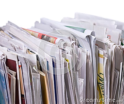 Vertical pile of newspapers and flyers Stock Photo