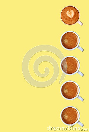 Row of Frothy Espresso Coffees Pattern on Yellow Background Stock Photo
