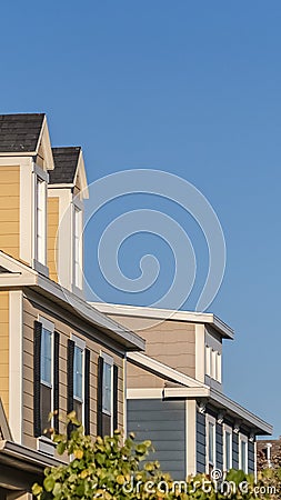 Vertical Row of upper floor facades of urban homes Stock Photo