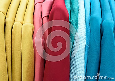 Vertical Rows of Colourful Women Coats Stock Photo