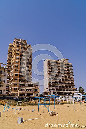 Vertical shot of abandoned hotels on the beach of the ghost town resort of Varosha Editorial Stock Photo