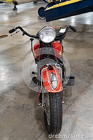 Vertical shot of an antique 1936 Indian 4 Motorcycle on display in a museum Editorial Stock Photo