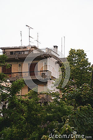 Vertical shot of an apartment building and trees Stock Photo