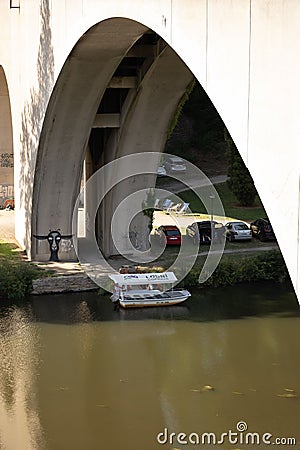 Vertical shot of the arch bridge over the water in Loket, Czech Republic on a sunny day Editorial Stock Photo