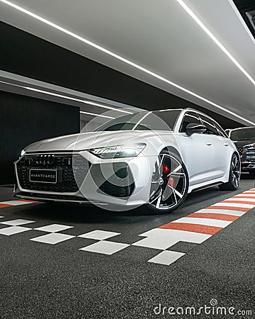 Vertical shot of an Audi RS6 Matte Silver parked in a showroom Editorial Stock Photo