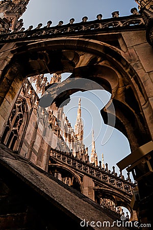 Vertical shot of a beautiful view of Duomo di Milano and an antique arch in Milan, Italy Stock Photo