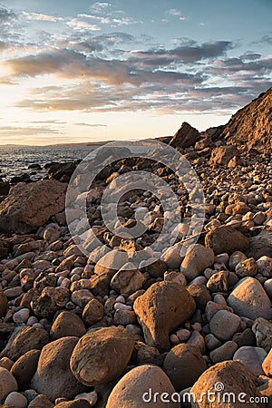 Vertical shot of big stones on the shore of the sea, cool for background Stock Photo