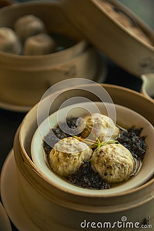 Vertical shot of a bowl of dumplings and vegetables Stock Photo