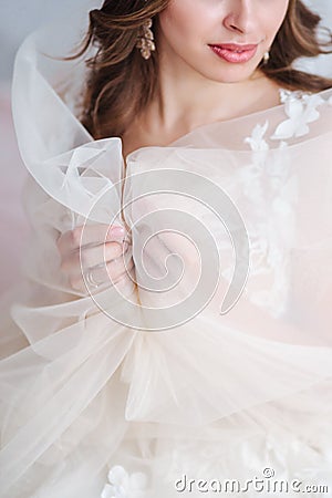 Vertical shot with bride`s hands in focus. Wedding concepts, details, ideas and themes, bride morning Stock Photo