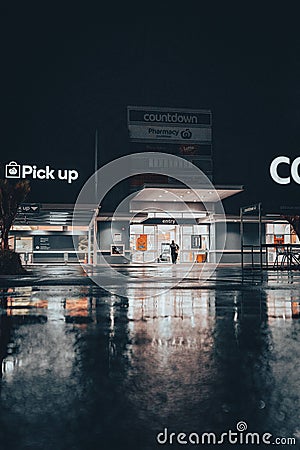 Vertical shot of the Countdown Botany Downs supermarket after rain at night in Auckland, New Zealand Editorial Stock Photo