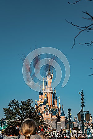 Vertical shot of The Castle of the Beauty in the Sleeping Forest with fireworks above it in France Editorial Stock Photo