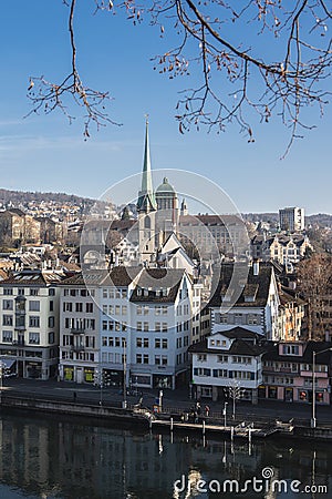 Vertical shot of the cityscape of Zurich with the Predigerkirch church steeple in Switzerland Editorial Stock Photo