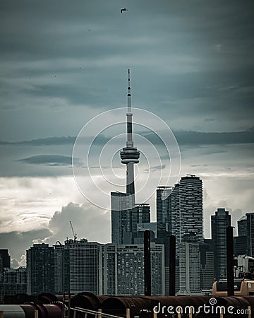 Vertical shot of The CN Tower under a stormy sky in Toronto, Canada Editorial Stock Photo