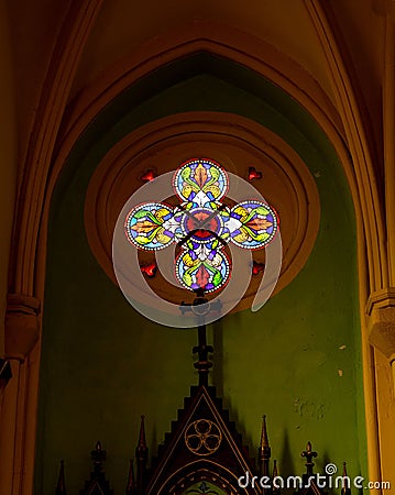 Vertical shot of colorful stainless glass in a church Stock Photo