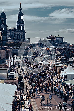 Vertical shot of the crowd on the street against the Church of the Holy Cross Editorial Stock Photo