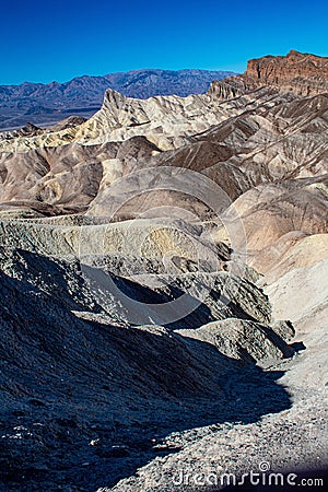 Vertical shot of curly mountains in Death Valley National Park in Skidoo locating in California Stock Photo