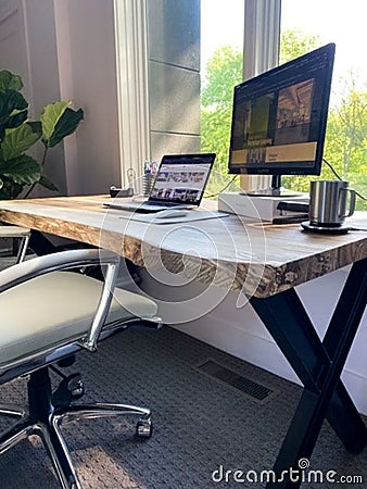 Vertical shot of a design of a home office with modern equipment and objects Editorial Stock Photo