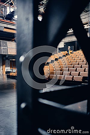Vertical shot of an empty theatre auditorium with a lot of chairs in Roubaix, France Editorial Stock Photo