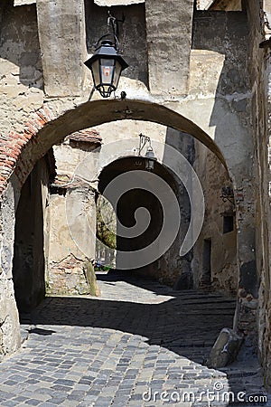 Vertical shot of the entrance to the Medieval Fort located in Sighisoara, Romania Stock Photo