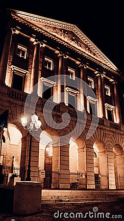 Vertical shot of the facade of Santa Maria della Piazza catholic church at night Stock Photo