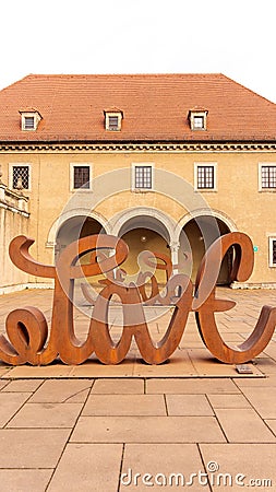 Vertical shot of the famous love sculpture in Munich, Bavaria, Germany Editorial Stock Photo