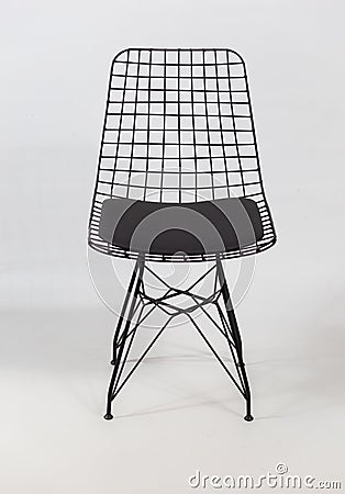 Vertical shot of a futuristic chair with a chain in the back behind a white background Stock Photo