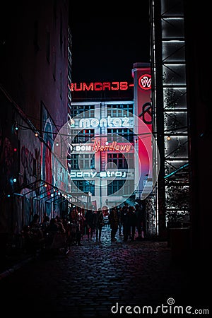 Vertical shot of Galeria Neon Side at night with people outdoor in Poland,Wroclaw Editorial Stock Photo
