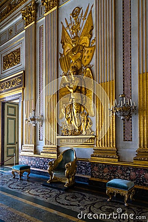 Vertical shot of gold decorations on the walls in the Royal Palace of Caserta, Campania Editorial Stock Photo