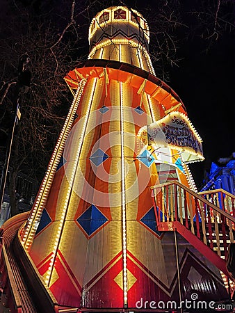Vertical shot of the illuminated Helter Skelter Slide at the Belfast Christmas Market Editorial Stock Photo