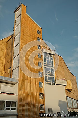 Vertical shot of an imposing golden facade of the Berlin Philharmonic Hall in Berlin, Germany Stock Photo