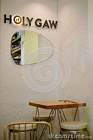 Vertical shot of the Interior of a Filipino restaurant in Hong Kong with an oval-shaped mirror Editorial Stock Photo