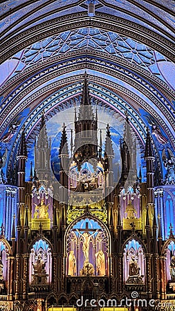 Vertical shot of the interior of Notre Dame Cathedral of Montreal, blue vaulted ceilings in Canada Editorial Stock Photo