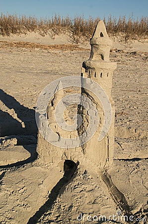 Vertical shot of an intricate sand castle on a beach Stock Photo