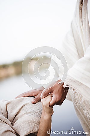 Vertical shot of Jesus Christ healing the female with a blurred background Stock Photo