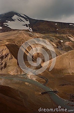 Vertical shot of the Kerlingarfjoll over a river in Iceland Stock Photo