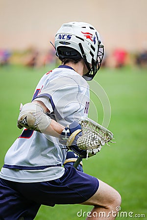 Vertical shot of a lacrosse player in the field Editorial Stock Photo
