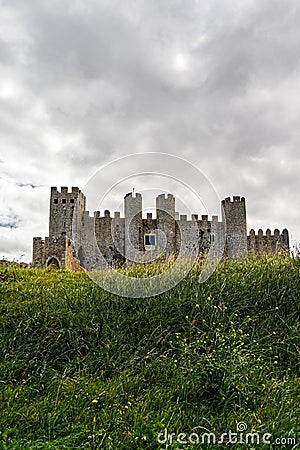 Vertical shot of a medieval Castle of Obidos in Portugal on a rainy day Stock Photo