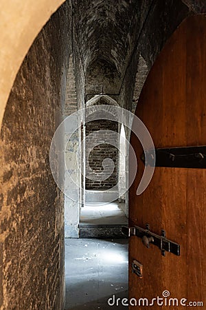 Vertical shot of a medieval stone hallway inside the Tower of London, England, UK Editorial Stock Photo