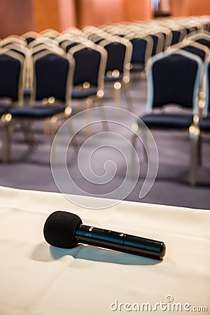 Vertical shot of microphone and auditorium Stock Photo