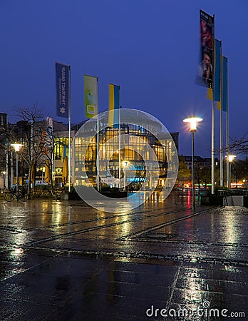 Vertical shot of the modern Cinedome movie complex at the media park in Cologne at night Editorial Stock Photo