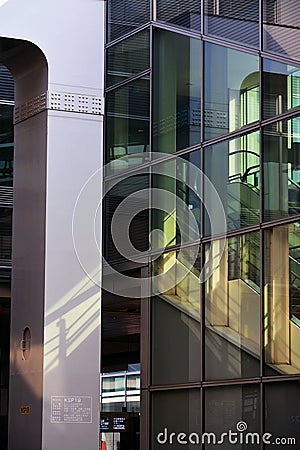 Vertical shot of the modern glass building. Tokyo, Japan Stock Photo