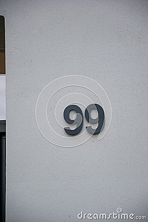 Vertical shot of the number 99 on a door Stock Photo