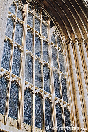 Vertical shot of an old window of a Gothic style church Stock Photo