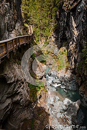 Vertical shot of path in Gorner Gorge with river Stock Photo