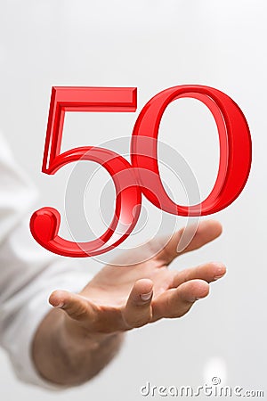 Vertical shot of a person presenting a virtual projection of the digital number fifty Stock Photo