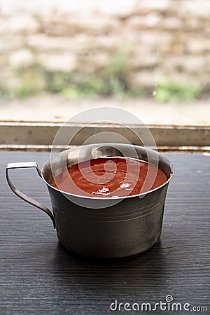 Vertical shot of a plate of ketchup sauce Stock Photo